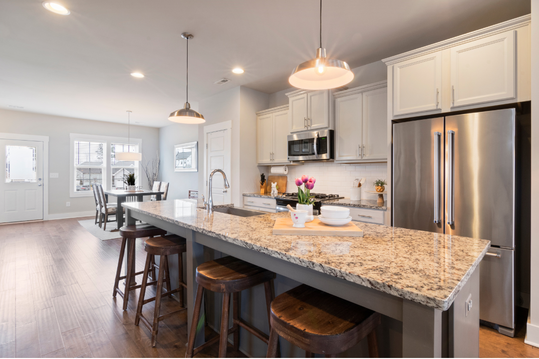 A spotless open-plan kitchen and living area in a Rancho Cucamonga home